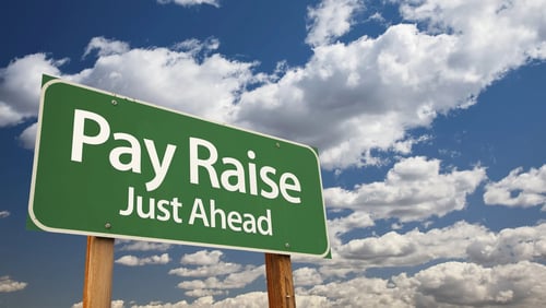 A sign that says Pay Raise Just Ahead